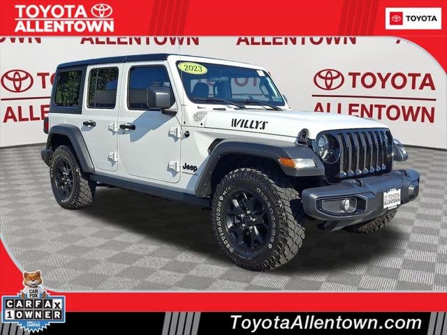 2023 Jeep Wrangler Sport in Bright White Clearcoat — front three-quarter view