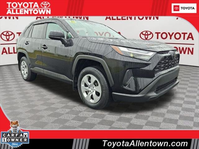 2025 Toyota RAV4 LE in Attitude Black Mc. — front three-quarter view