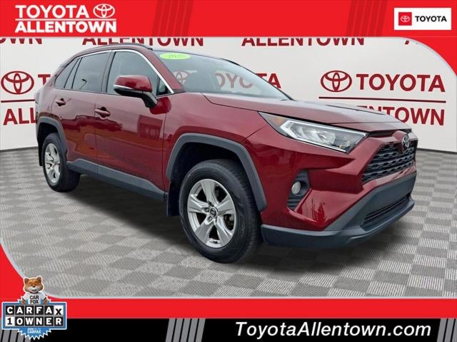 2020 Toyota RAV4 XLE in Ruby Flare Pearl — front three-quarter view