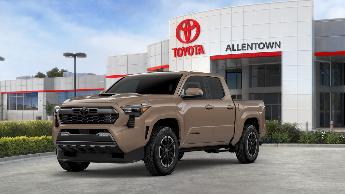 2026 Toyota Tacoma TRD Sport in Mudbath — front three-quarter view