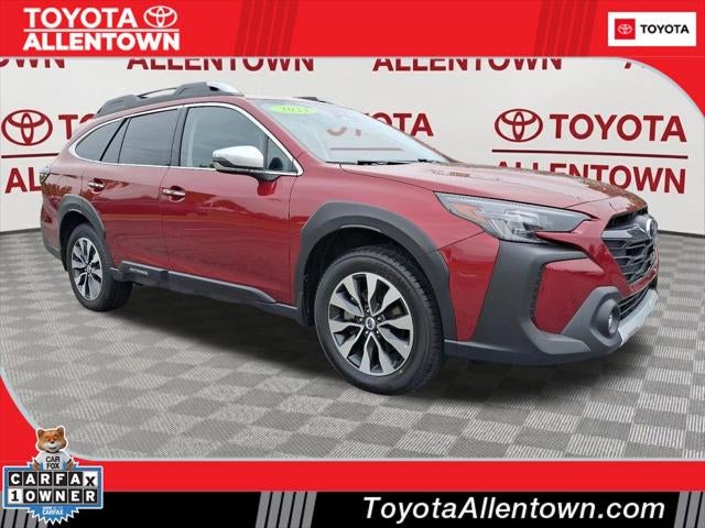 2023 Subaru Outback Touring XT in Crimson Red Pearl — front three-quarter view