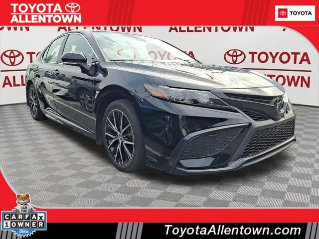 2024 Toyota Camry SE in Midnight Black Metal — front three-quarter view