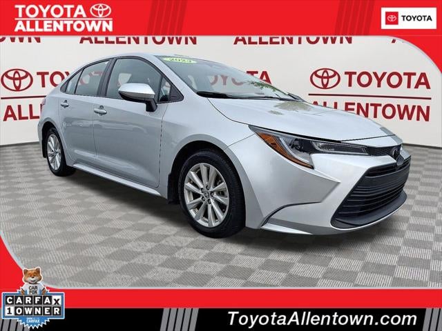 2023 Toyota Corolla LE in Classic Silver Metallic — front three-quarter view