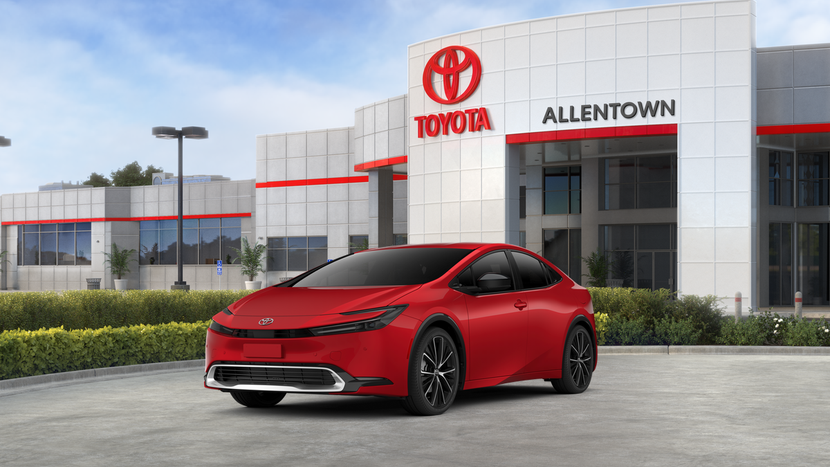 2026 Toyota Prius XLE in Supersonic Red — front three-quarter view